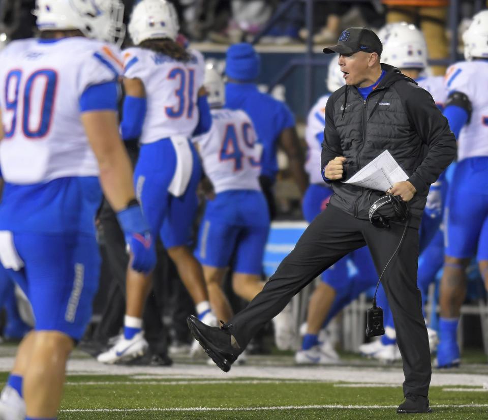 Boise State interim head coach Spencer Danielson celebrates after a Utah State turnover in the first half of an NCAA college football game Saturday, Nov. 18, 2023, in Logan, Utah. | Eli Lucero/The Herald Journal via AP