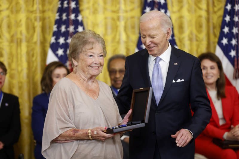 U.S. President Joe Biden stands with Lynn Cannon after posthumously awarding her late grandfather, Native American athlete Jim Thorpe with the Presidential Medal of Freedom, the country's highest civilian honor, during a ceremony in the East Room of the White House in Washington, D.C., on Friday. Photo by Jonathan Ernst/UPI