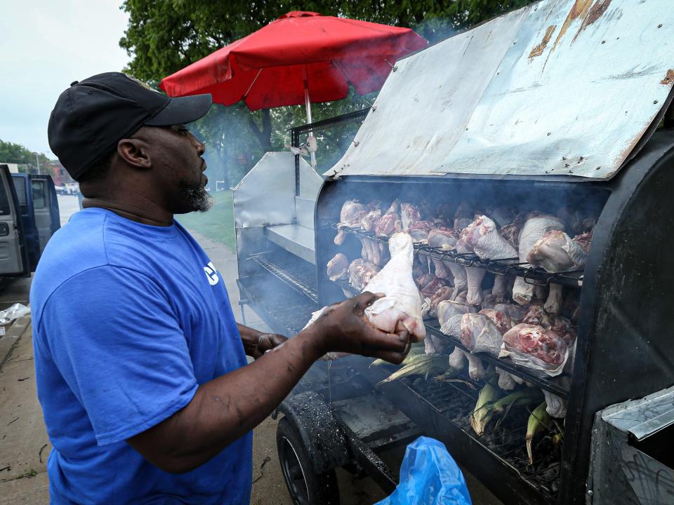 A vendor prepares food during the 48th Annual Juneteenth Day Festival in Wisconsin.