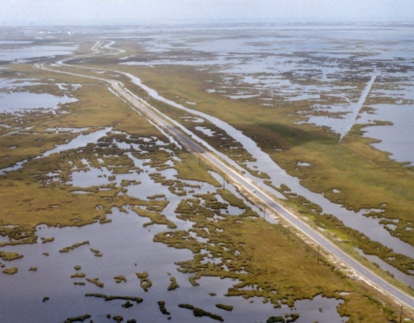 La. 1 winds through coastal wetlands in southern Lafourche Parish.