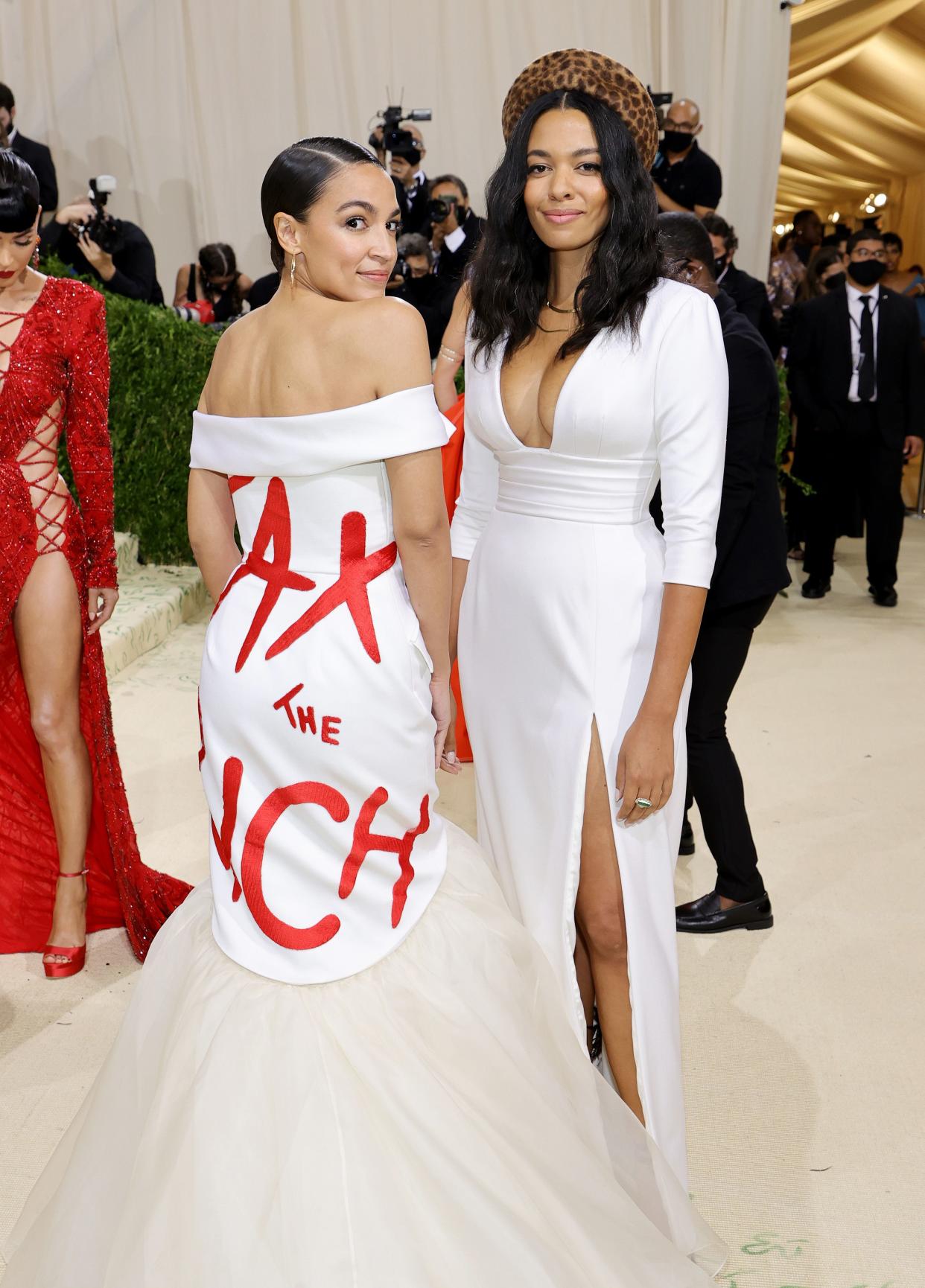 Alexandria Ocasio-Cortez, left, attends The 2021 Met Gala Celebrating In America: A Lexicon Of Fashion at Metropolitan Museum of Art on Sept. 13, 2021 in New York.