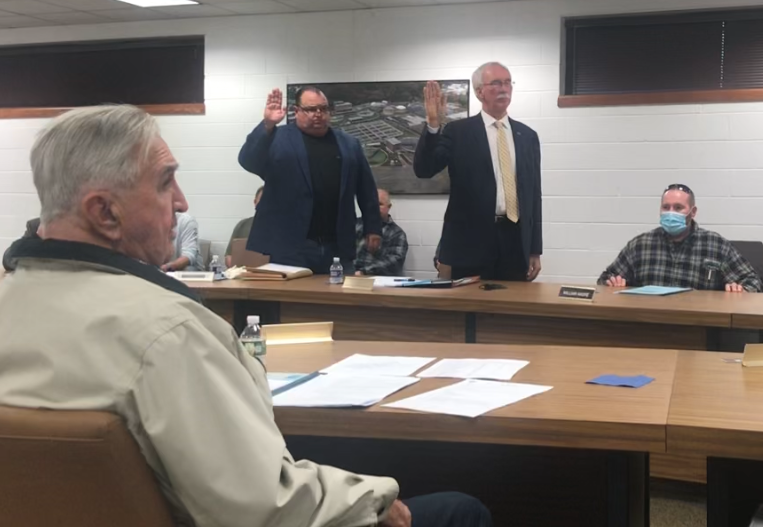 Dean Dellaquila of Bridgeton and William Whelan of Upper Deerfield Township (standing, left to right) take their oaths of office Thursday, Nov. 18, 2021 as the newest members of the Board of Commissioners of the Cumberland County Utilities Authority. Seated to their left is Commissioner William Andre and Commissioner Zarko Rajacich is seated in the foreground.