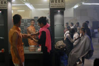 <p>Pakistani models get ready backstage to present designers creations during Men’s Fashion Week in Karachi, Pakistan, May 27, 2013. (AP Photo/Shakil Adil) </p>