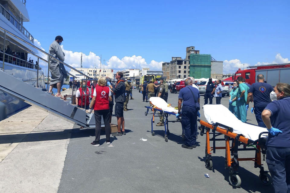 Survivors arrive by yacht after a rescue operation at the port in Kalamata town, about 240 kilometers (150miles) southwest of Athens on Wednesday, June 14, 2023. Authorities say at least 30 people have died after a fishing boat carrying dozens of migrants capsized and sank off the southern coast of Greece. A large search and rescue operation is underway. (www.argolikeseidhseis.gr via AP)