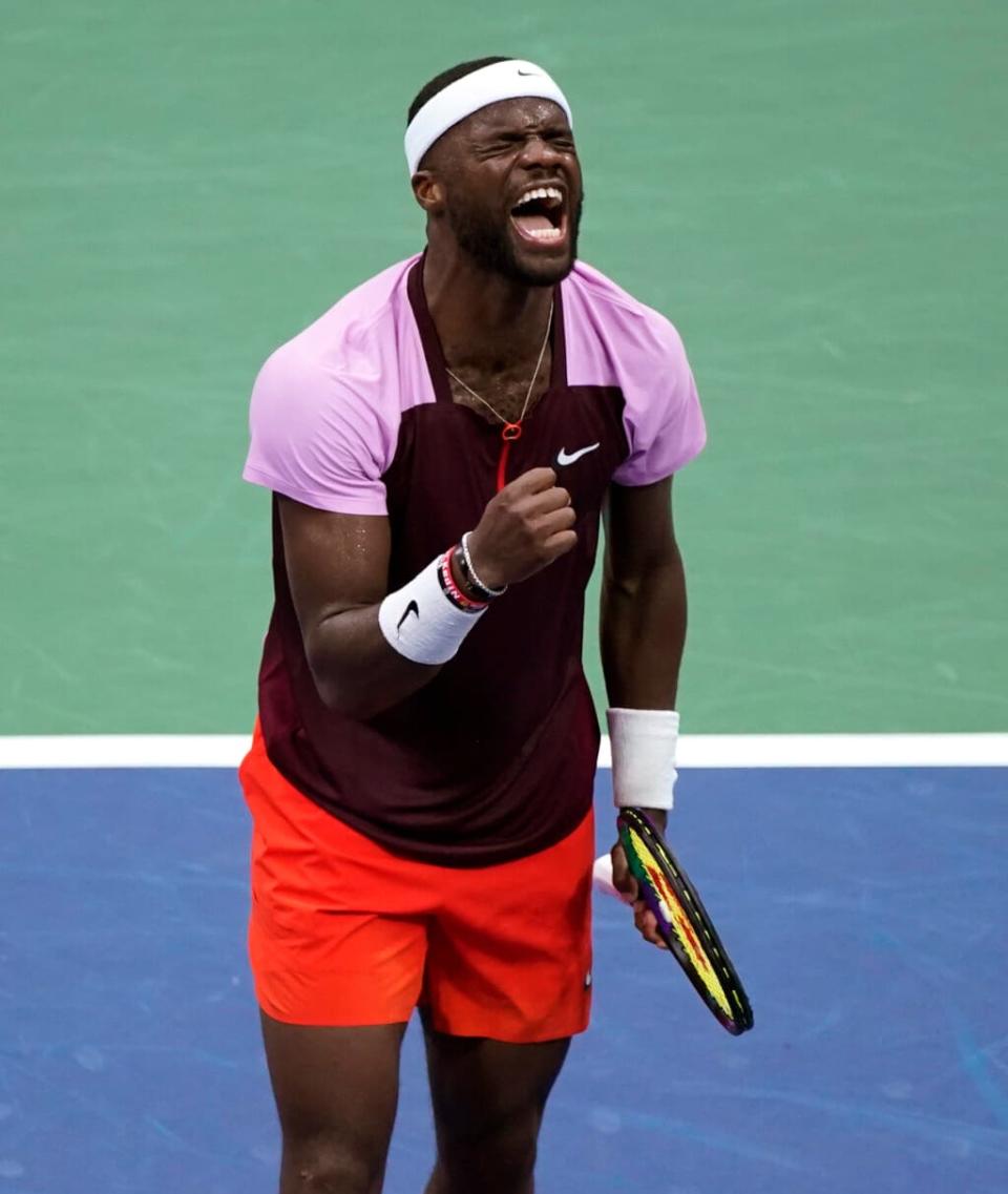 Frances Tiafoe celebrates after winning a point against Rafael Nadal, of Spain, during the fourth round of the U.S. Open tennis championships, Monday, Sept. 5, 2022, in New York. (AP Photo/Eduardo Munoz Alvarez)