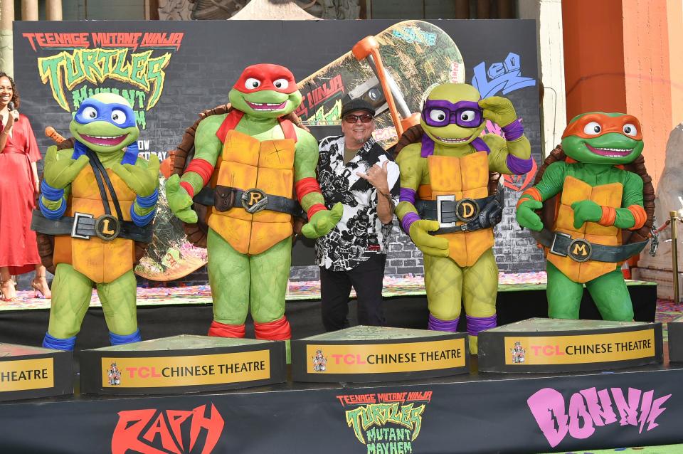 Teenage Mutant Ninja Turtles Leonardo, from left, Raphael, Donatello and Michelangelo with creator Kevin Eastman, center, appear at a hand and footprint ceremony on Sept. 7, 2023, at the TCL Chinese Theatre in Los Angeles.