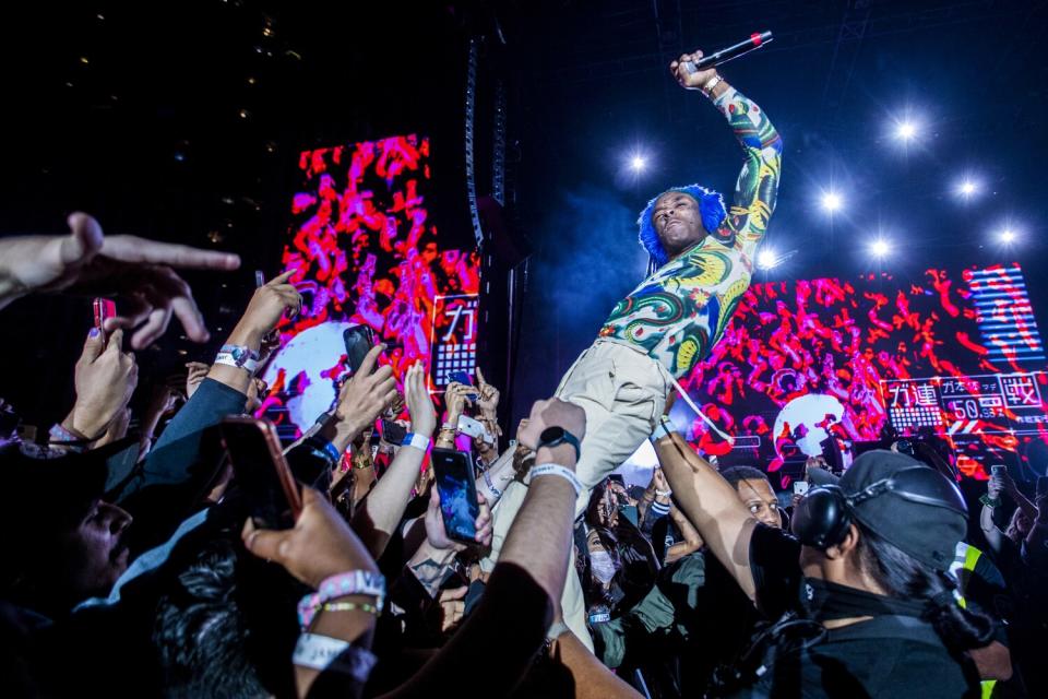 Lil Uzi Vert performs in the middle of the crowd.