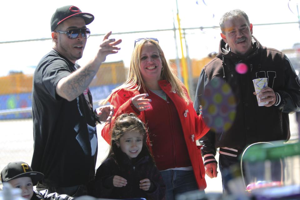 In a Saturday March 30, 2013 photo, the Cruz family from the Bronx borough of New York play an arcade game at Eldorado Auto Skooter in New York's Coney Island. Despite making the traditional Palm Sunday opening, many of the seasonal businesses at Coney Island are still reeling from the aftermath of Superstorm Sandy.(AP Photo/Mary Altaffer)