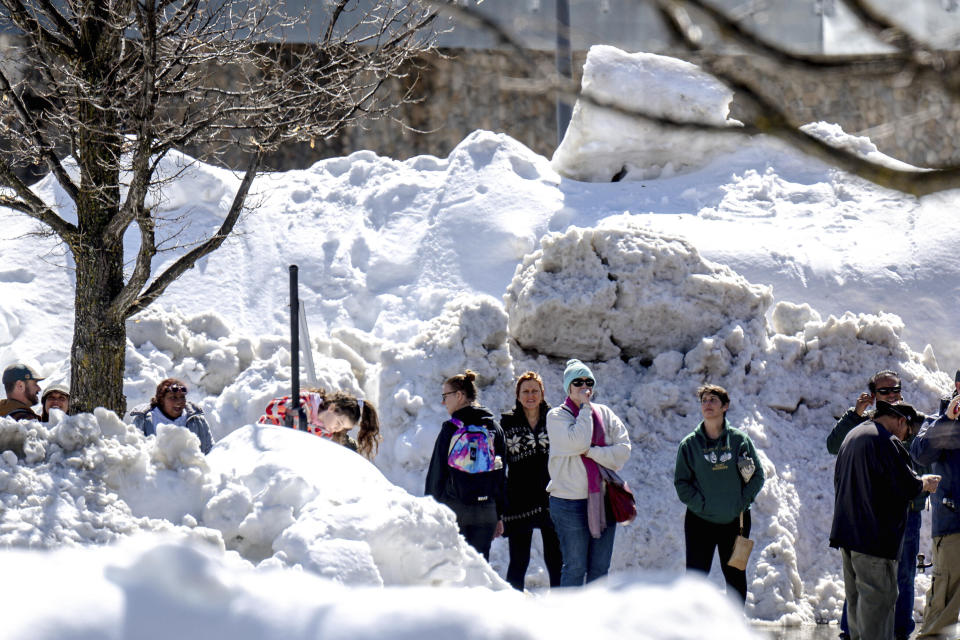 Residents in San Bernardino Mountain brave long lines for food at Goodwin & Son's Market in Crestline, Calif., Friday, March 3, 2023, amidst a shortage caused by heavy snowfall and difficulties with delivery truck access on Highway 18. (Watchara Phomicinda/The Orange County Register via AP)