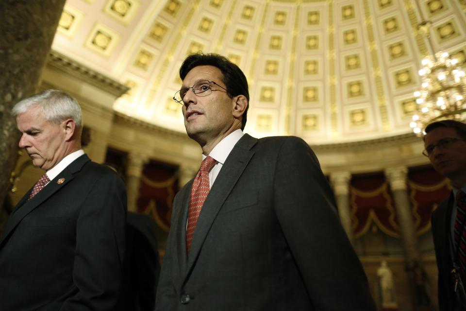 U.S. House Majority Leader Eric Cantor (R-VA) (C) walks to the House floor for a series of late-night votes Saturday session at the U.S. Capitol in Washington, September 29, 2013. The House of Representatives early Sunday, ignoring a White House veto threat, approved a one-year delay in funding major provisions of President Barack Obama's landmark healthcare law as part of a government funding bill. REUTERS/Jonathan Ernst