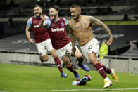 West Ham's Manuel Lanzini, right, celebrates after scoring his side's third goal during the English Premier League soccer match between Tottenham Hotspur and West Ham United at the Tottenham Hotspur Stadium in London, England, Sunday, Oct. 18, 2020. (AP photo/Matt Dunham, Pool)