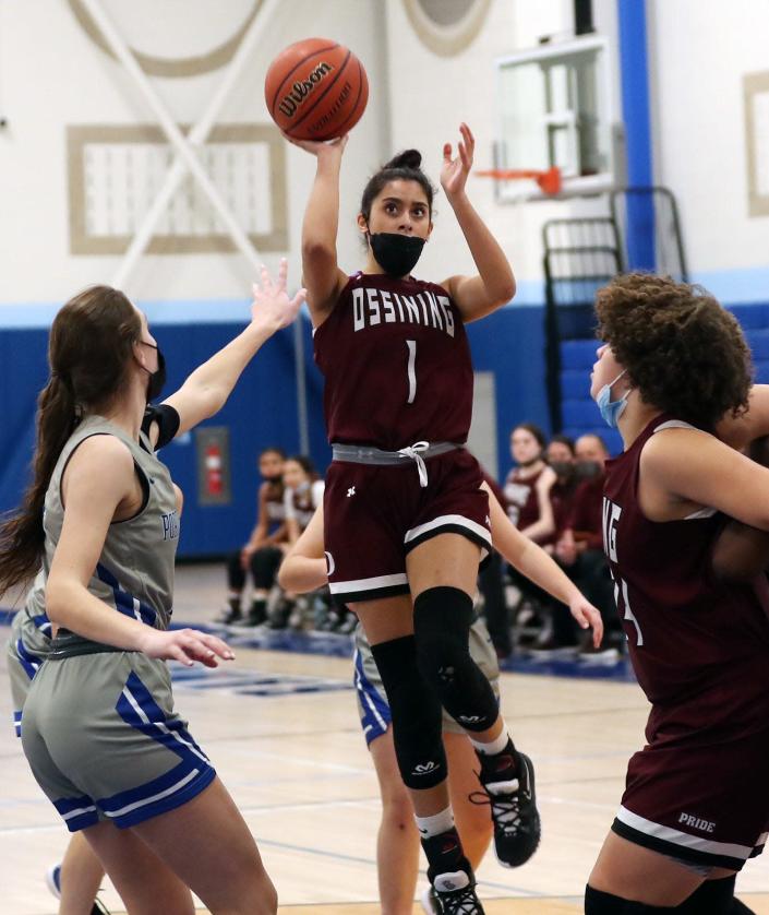 Ossining&#39;s Michelle Mercado (1 ) puts up a shot against Port Chester during girls basketball action at Port Chester High School Jan. 13, 2022. Ossining won the game.