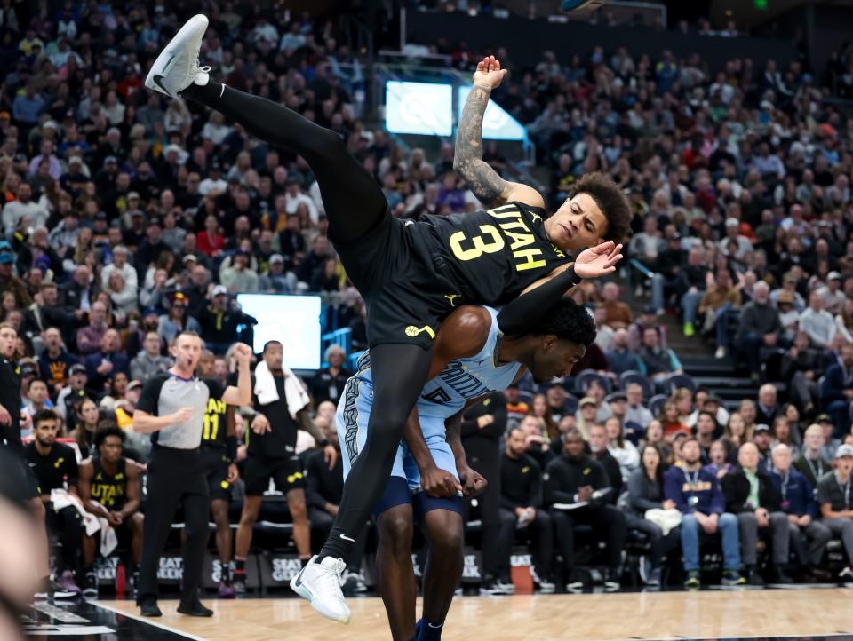 Utah Jazz guard Keyonte George (3) falls on Memphis Grizzlies guard <a class="link " href="https://sports.yahoo.com/nba/players/6737" data-i13n="sec:content-canvas;subsec:anchor_text;elm:context_link" data-ylk="slk:Vince Williams Jr.;sec:content-canvas;subsec:anchor_text;elm:context_link;itc:0">Vince Williams Jr.</a> (5) during the game at the Delta Center in Salt Lake City on Wednesday, Nov. 1, 2023. | Spenser Heaps, Deseret News