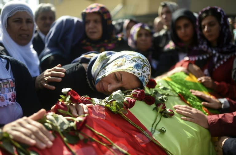 Relatives mourn over the coffin of a victim of the twin bombings in Ankara, during a funeral in Istanbul on October 12, 2015