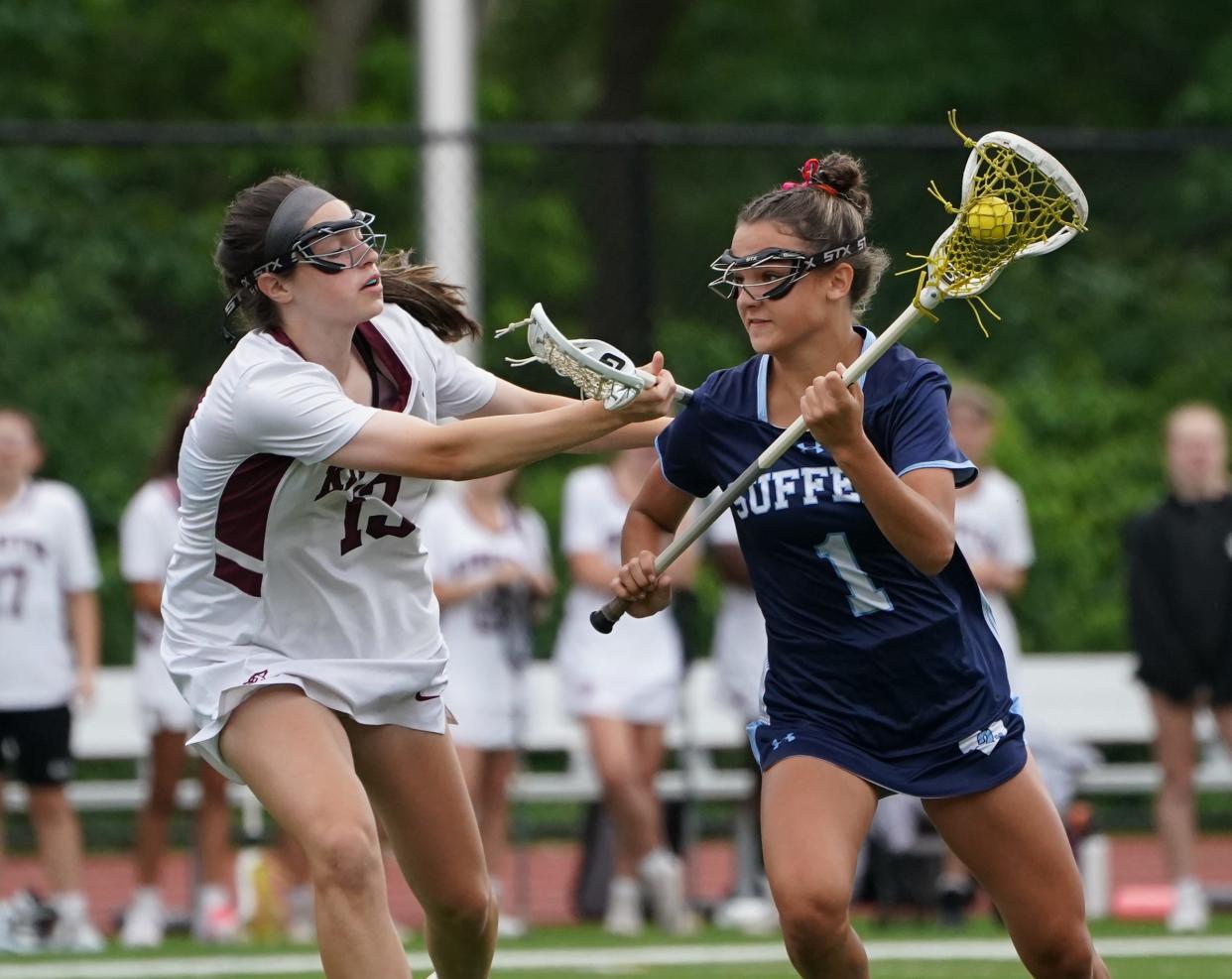 Suffern's Michaela Fay (1) works against Kingston's Alexandra Coffey (13) in the Class A state regional final girls lacrosse game at James I. O'Neill High School in Highland Falls on Saturday, June 3, 2023.