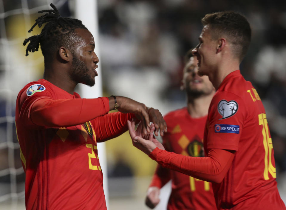 Belgium player Michy Batshuayi, left, celebrates a goal against Cyprus during the Euro 2020 group I qualifying soccer match between Cyprus and Belgium at the GSP stadium in Nicosia, Cyprus, Sunday, March 24, 2019. (AP Photo/Philippos Christou)