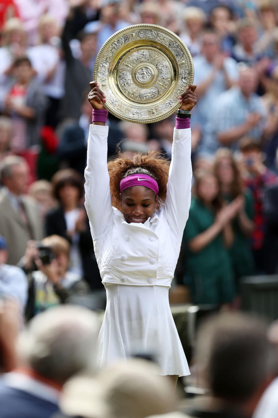 Serena Williams of the USA lifts the winners trophy and celebrates after her Ladies Singles final match against Agnieszka Radwanska of Poland on day twelve of the Wimbledon Lawn Tennis Championships at the All England Lawn Tennis and Croquet Club on July 7, 2012 in London, England. (Photo by Clive Rose/Getty Images)