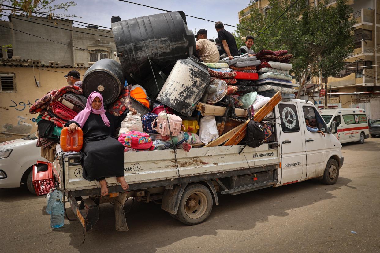 Palestinians pile their belongings on a vehicle as it drives to safer areas in Rafah, in the southern Gaza Strip, on May 10, 2024, amid the ongoing conflict between Israel and the militant group Hamas.