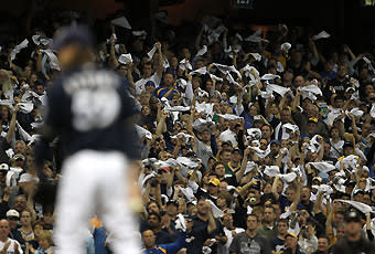 A raucous crowd in Milwaukee stayed engaged through the ninth inning, when John Axford got the final outs in a 9-4 win