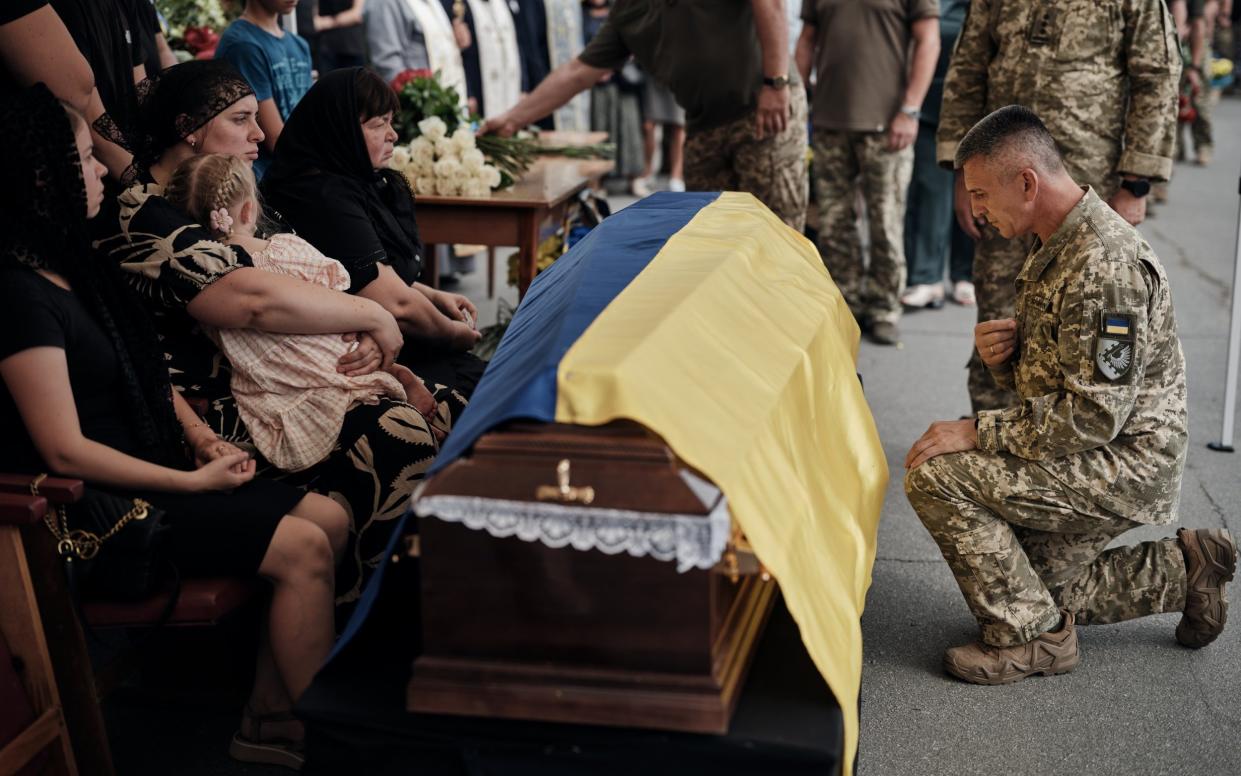 People pay respects at the funeral of Ukrainian F-16 pilot Oleksiy Mes