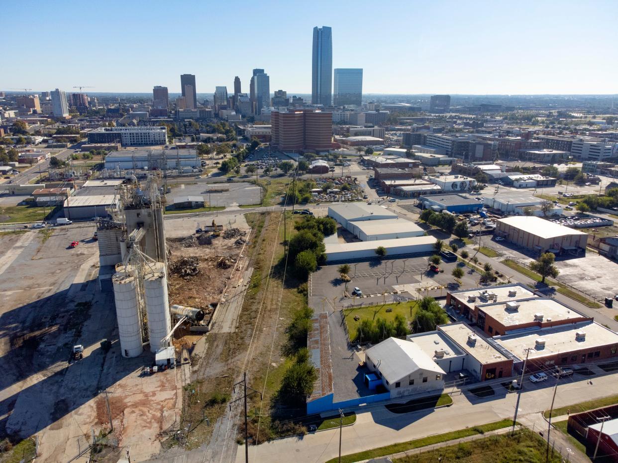 The former Purina plant, shown left, is being torn down, which will open several acres for development next to Beer City Music Hall, shown right. The neglected industrial area is turning into the next development hot spot west of downtown.