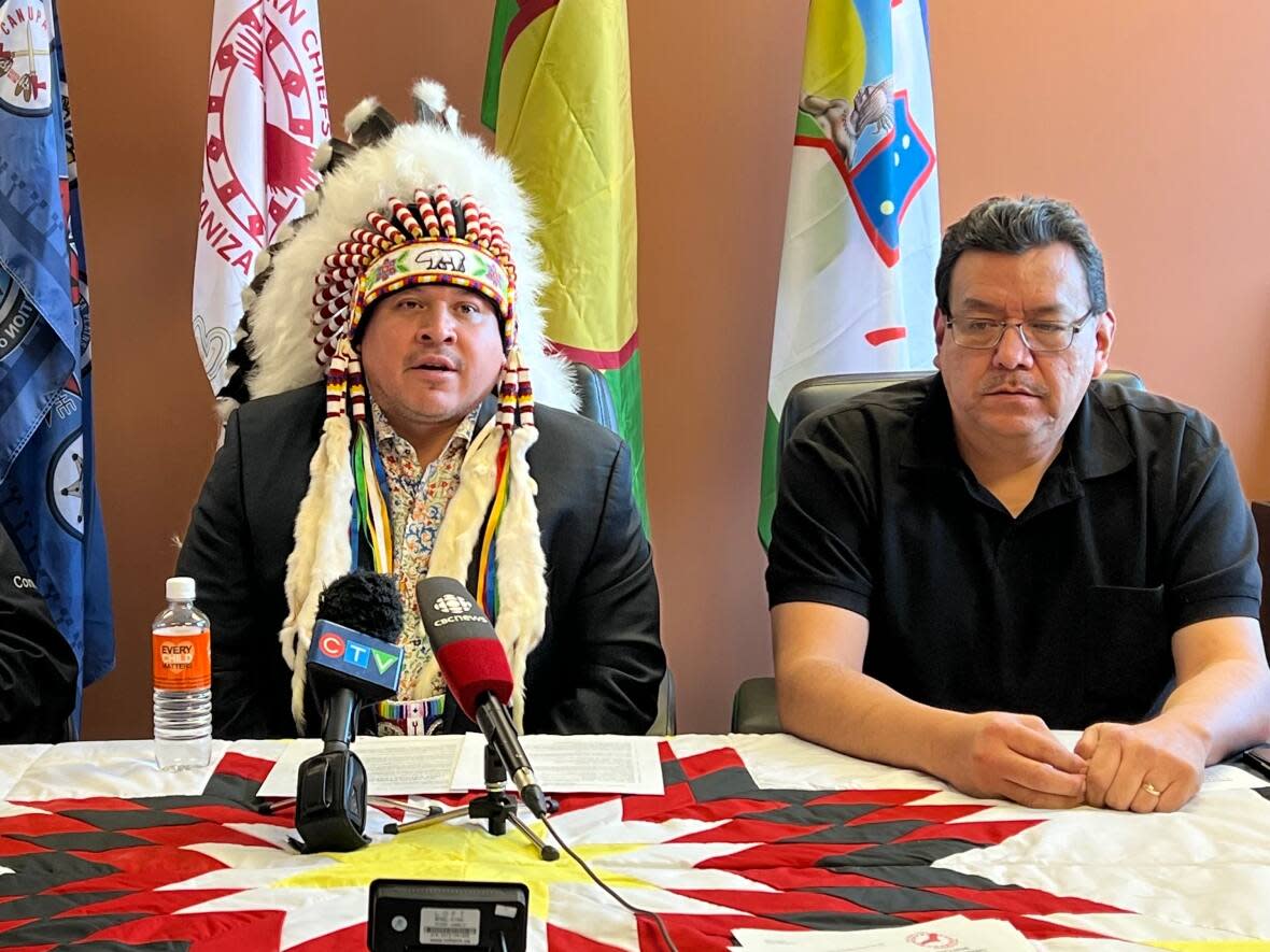 Southern Chiefs' Organization Grand Chief Jerry Daniels, centre, with Lake Manitoba First Nation Chief Cornell McLean, left, and Pinaymootang First Nation Chief Kurvis Anderson at a Monday news conference. (Travis Golby/CBC - image credit)