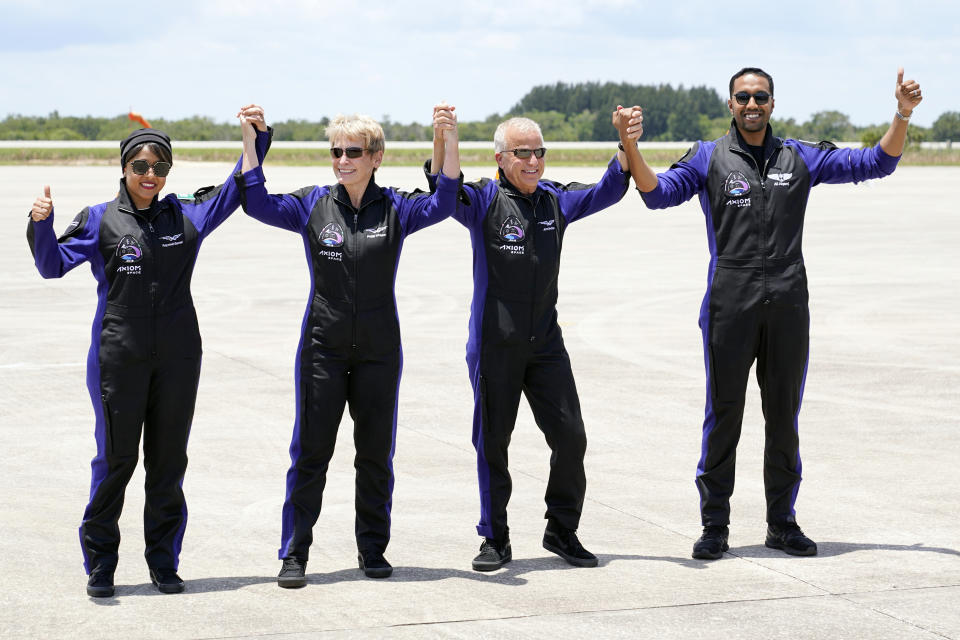 The crew of the SpaceX Falcon 9 rocket, with the Crew Dragon spacecraft, from left, Saudi Arabian astronaut Rayyanah Barnawi, commandeer Peggy Whitson, pilot John Shoffner and Saudi Arabian astronaut Ali al-Qarni arrive at the Kennedy Space Center in Cape Canaveral, Fla., before their launch to the International Space Station, Sunday, May 21, 2023. (AP Photo/John Raoux)