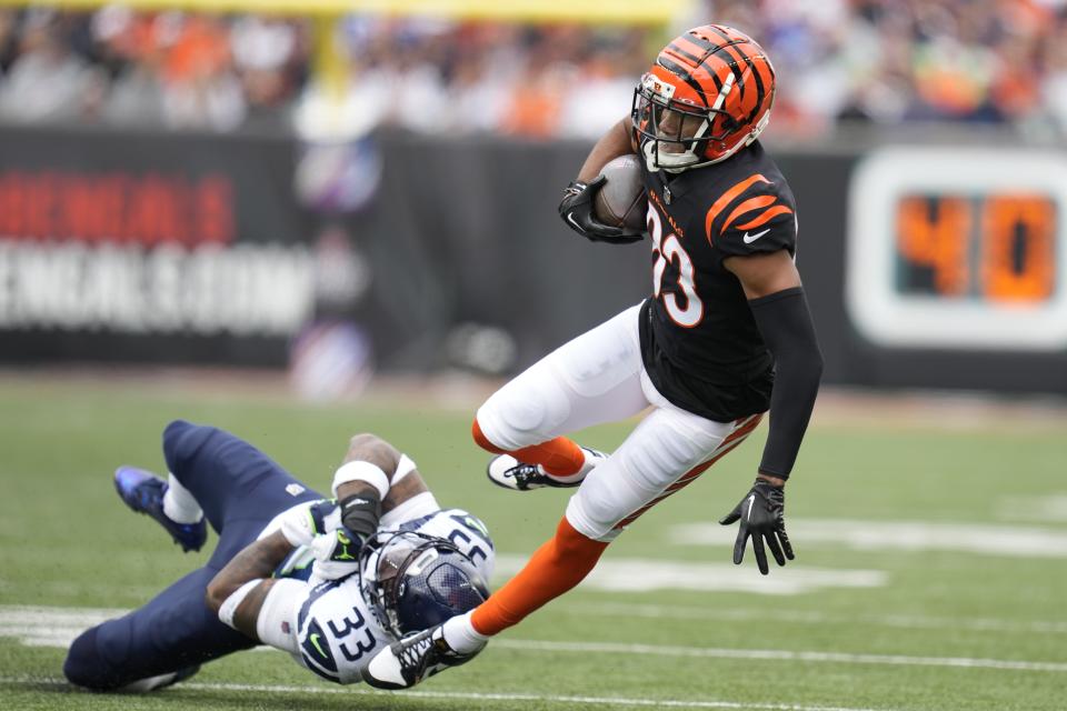 Cincinnati Bengals' Tyler Boyd (83) is tackled by Seattle Seahawks' Jamal Adams during the first half of an NFL football game, Sunday, Oct. 15, 2023, in Cincinnati. (AP Photo/Michael Conroy)