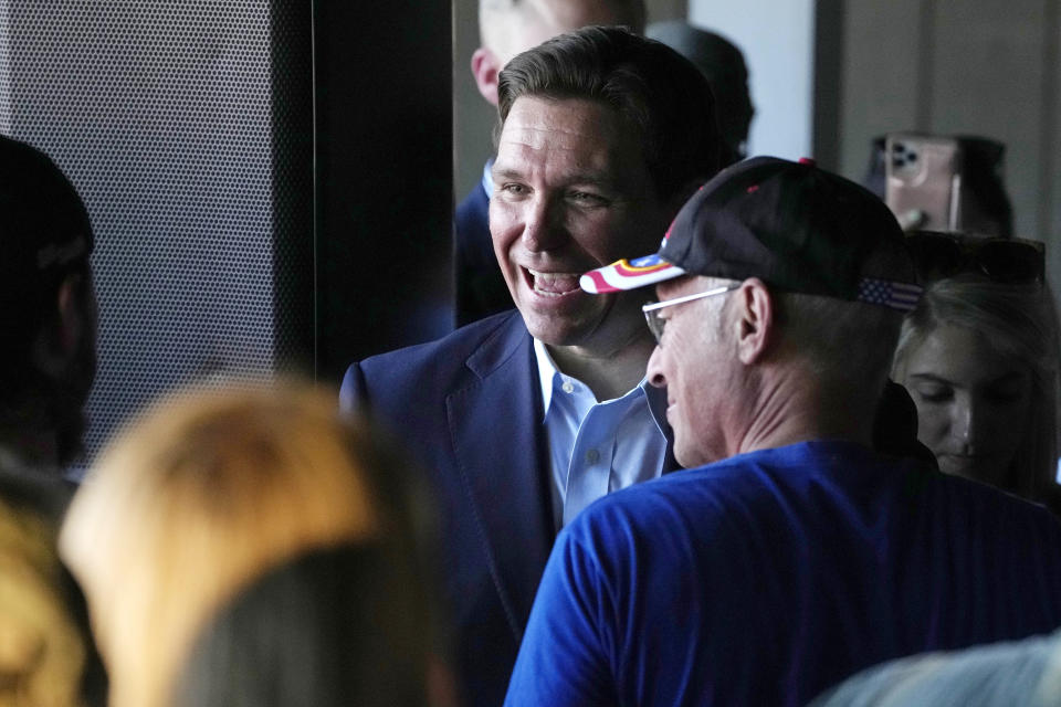 Republican presidential candidate Florida Gov. Ron DeSantis chats with guests during a campaign event, Thursday, June 1, 2023, in Salem, N.H. (AP Photo/Charles Krupa)