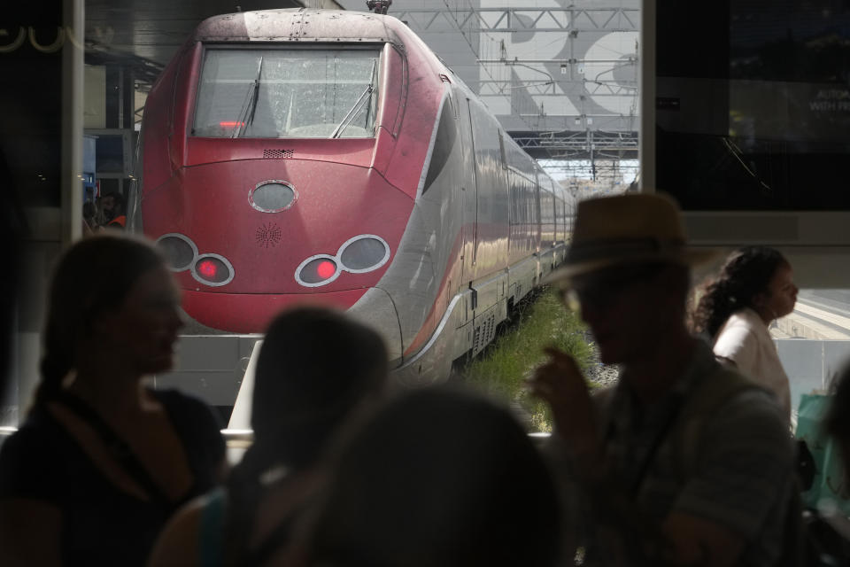 Passengers wait for their trains at Rome's termini central station during a national train strike, Thursday, July 13, 2023. Trenitalia and Italo train workers are on strike to demand better working conditions and training. (AP Photo/Gregorio Borgia)