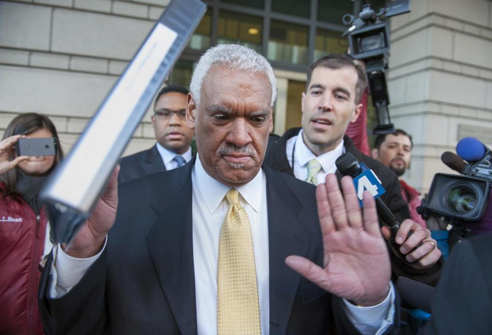 Jeffrey Thompson holds up his hands to indicate he will not speak to reporters as leaves federal court in Washington, after being charged Monday in a criminal information with two conspiracy offenses stemming from an ongoing investigation Monday, March 10, 2014. District of Columbia Mayor Vincent Gray was aware of an off-the-books "shadow campaign" to support his 2010 bid and personally requested the funds from Thompson, federal prosecutors said Monday. (AP Photo/Cliff Owen)