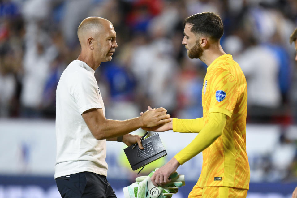 FILE - Coach Gregg Berhalter of the United States greets goalkeeper Matt Turner after losing 0-1 against Uruguay at the end of a Copa America Group C soccer match in Kansas City, Mo., July 1, 2024. Berhalter was fired as U.S. men's soccer coach Wednesday, July 10, after his team's first-round exit from the Copa America flamed doubts he was the right person to remain in charge for the 2026 World Cup, a person familiar with the decision told The Associated Press. (AP Photo/Reed Hoffman, File)