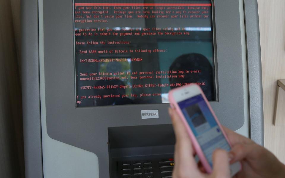 A ransom note on a payment terminal in a branch of Ukraine's state-owned bank Oschadbank during the June 27 cyber attack - Credit: VALENTYN OGIRENKO/Reuters