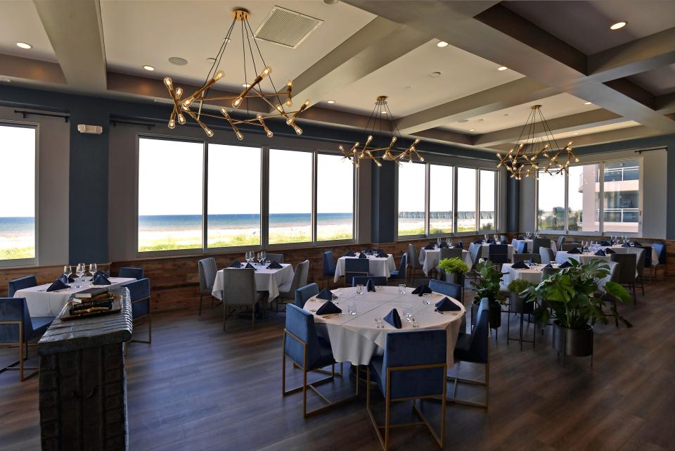 The upstairs Refined Dining restaurant overlooking the ocean at Refinery Jax Beach Tuesday, August 30, 2022. The newest Jacksonville Beach restaurant and bar complex at 831 First Street North is close to opening for the general public. Refinery Jax Beach offers Refined Dining, an upscale restaurant overlooking the ocean from the second-floor dining room, a more casual First Street Pub offers more casual dining and drinks, the ocean bar provides refreshments to those walking up from the beach and the Market and Lounge offers drinks and products for sale.