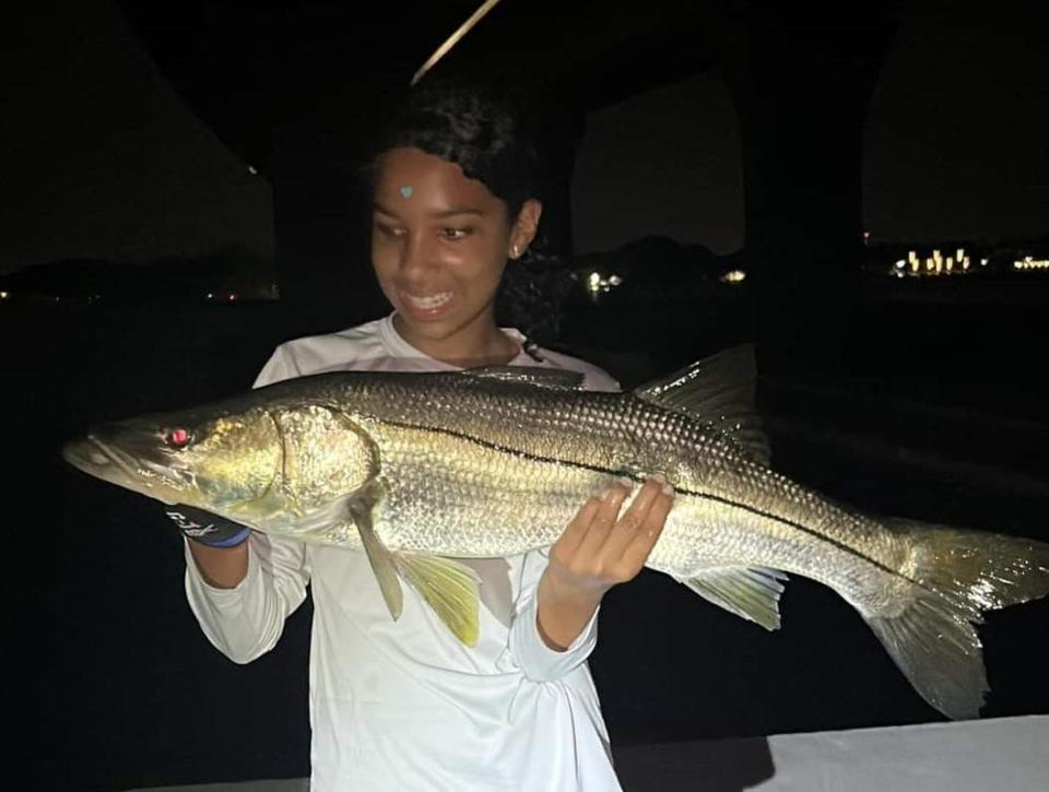 Kristia Lovelock, 12, was fishing at the Stuart Causeway Sept. 14, 2023 with a live mullet when she caught this legal-sized snook while fishing with her dad Kevin McCoy. The fish was released to fight again.