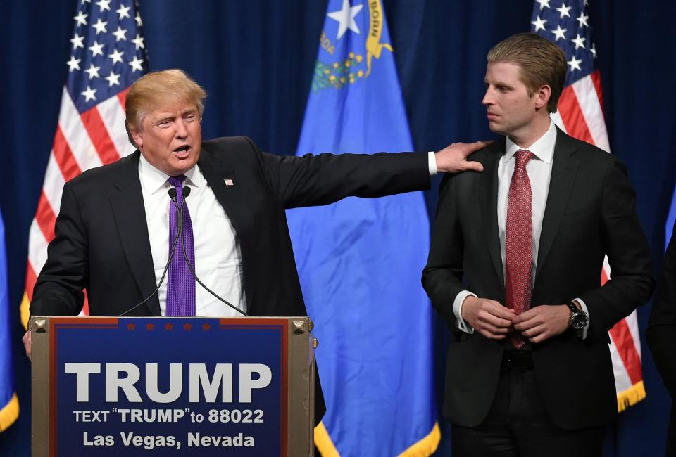 Republican presidential candidate Donald Trump (L) speaks as his son Eric Trump looks on during a caucus night watch party at the Treasure Island Hotel &amp; Casino on February 23, 2016 in Las Vegas, Nevada. The New York businessman won his third state victory in a row in the "first in the West" caucuses.