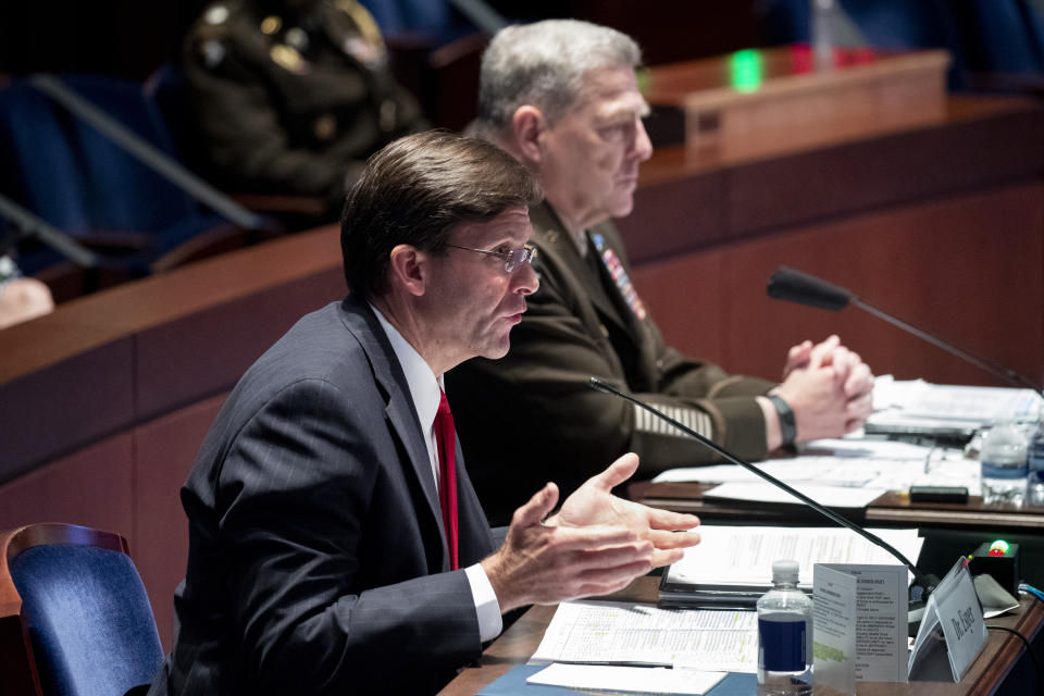 Defense Secretary Mark Esper testifies during a House Armed Services Committee hearing on Thursday, July 9, 2020, on Capitol Hill in Washington. Chairman of the Joint Chiefs of Staff Gen. Mark Milley listens at right. (Michael Reynolds/Pool via AP)