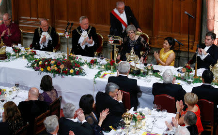 Britain's Prime Minister Theresa May is applauded after delivering a speech during the annual Lord Mayor's Banquet at Guildhall in London, Britain, November 12, 2018. REUTERS/Henry Nicholls