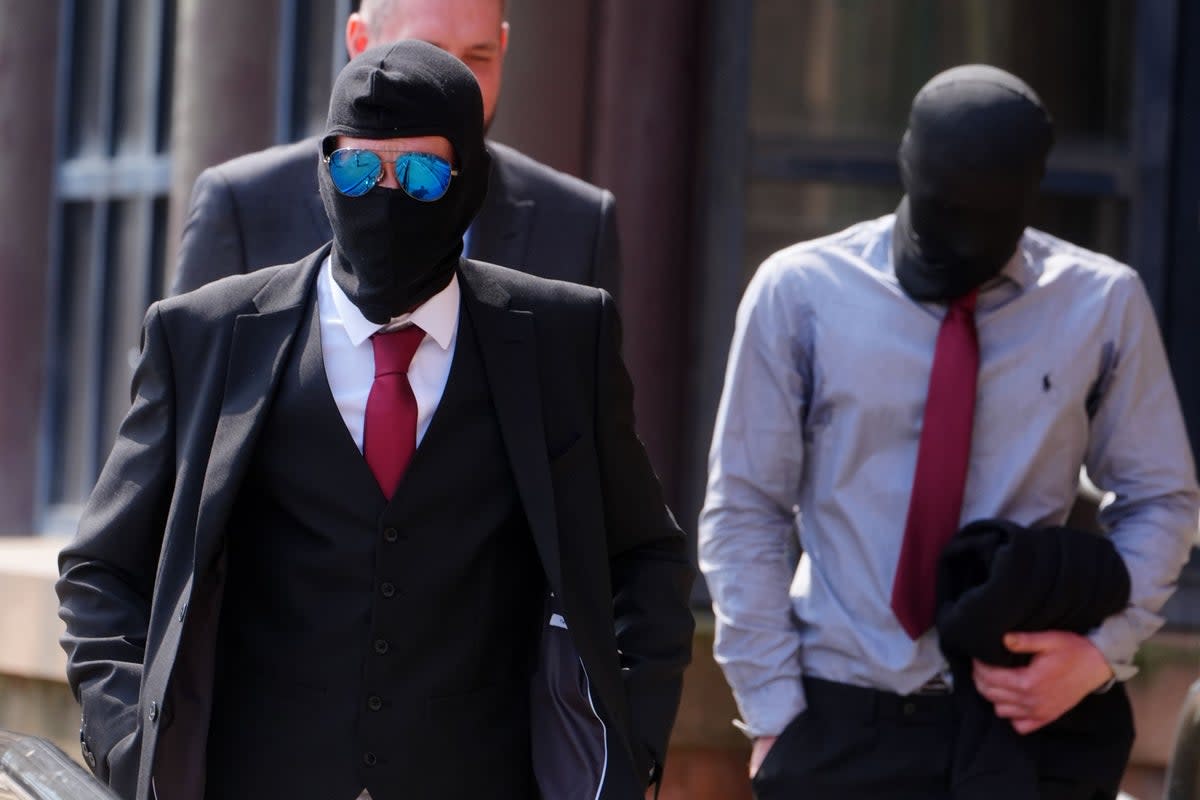 Daniel Graham, left, and Adam Carruthers, right, wore masks outside court at a previous hearing over the felled Sycamore Gap tree (Owen Humphreys/PA) (PA Wire)