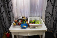 Food and toys on top of a table at Erika Oliva's family apartment in the southern neighbourhood of Vallecas in Madrid, Spain, Thursday Oct. 15, 2020. Spain's government expects the economy to contract 11.2% this year, while the International Monetary Fund puts the drop at 12.8%, the highest rate among developed economies. (AP Photo/Bernat Armangue)