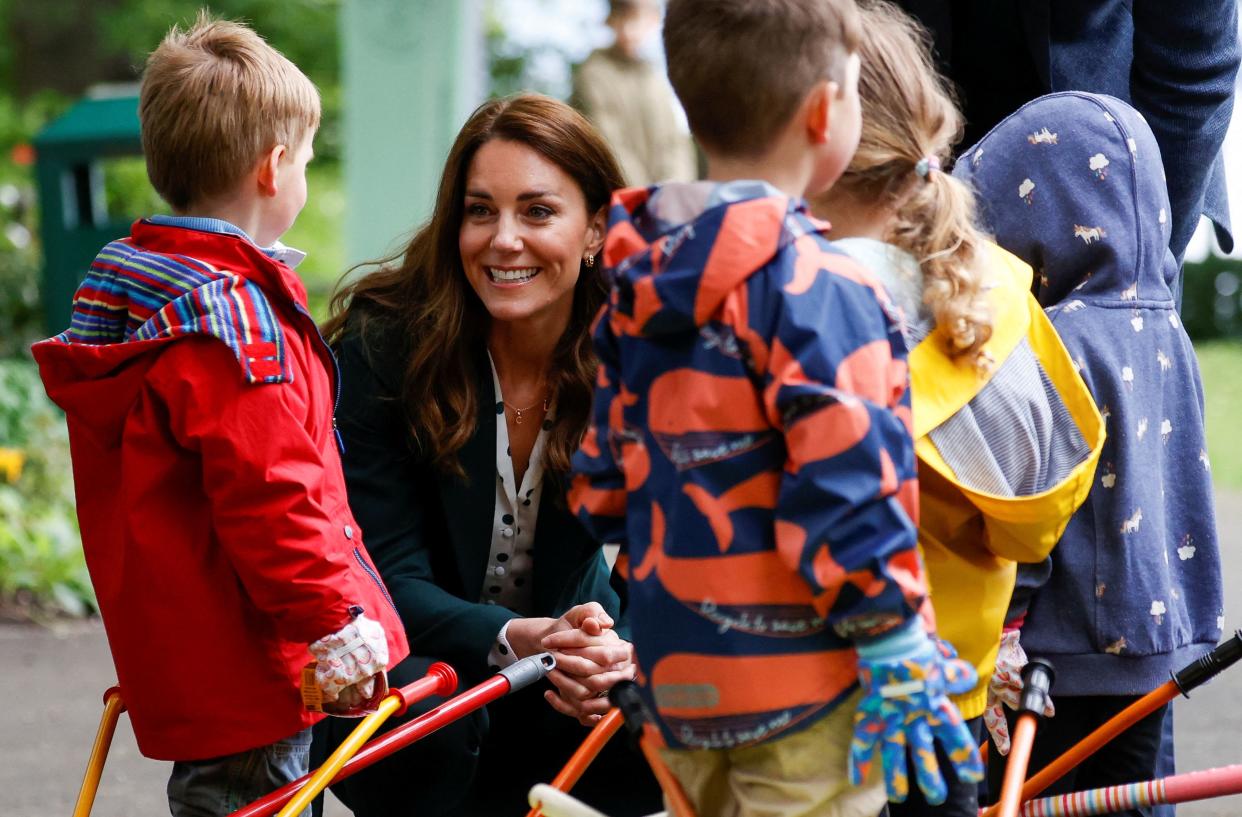 Britain's Catherine, Duchess of Cambridge meets children from Edzell Nursery as she visits Starbank Park to hear about the work of Fields in Trust, along with Britain's Prince William, Duke of Cambridge, in Edinburgh, Scotland on May 27, 2021. (Photo by PHIL NOBLE / POOL / AFP) (Photo by PHIL NOBLE/POOL/AFP via Getty Images)