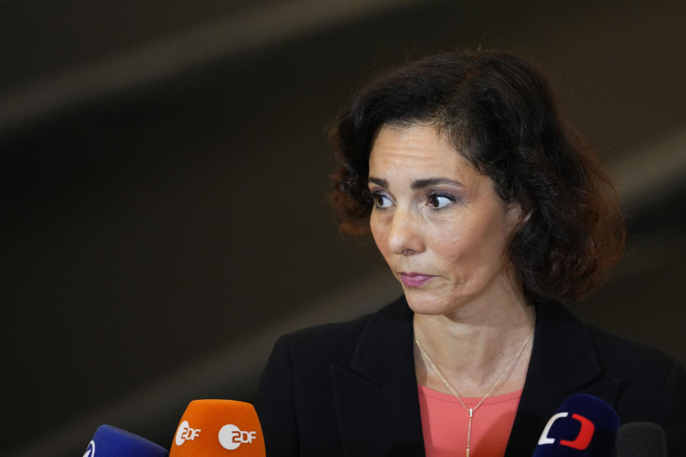 Belgium's Foreign Minister Hadja Lahbib speaks with the media as she arrives for a meeting of EU foreign ministers at the Prague Congress Center in Prague, Czech Republic, Wednesday, Aug. 31, 2022. (AP Photo/Petr David Josek)