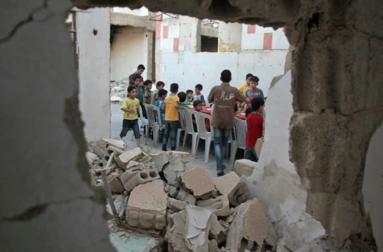 Open-air meals to break the Ramadan fast are a rare treat in rebel-held Douma outside Syria's capital, made possible only by relative calm that has followed an international deal to reduce violence