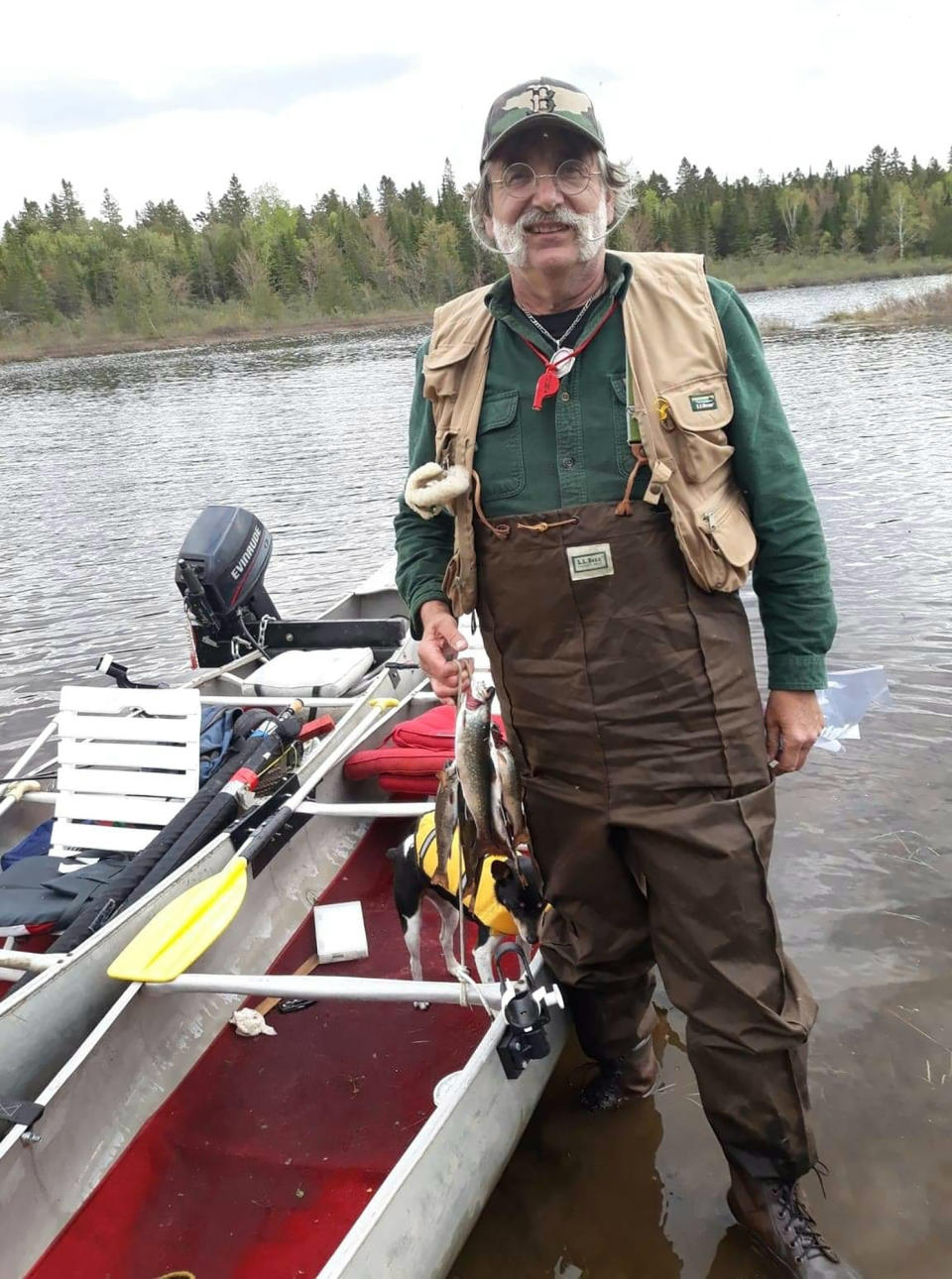 Michael Fiori is seen with a pair of tandem canoes in the wilderness of northern Maine on Monday, June 4, 2019, just hours before he and his brother Larry ended up in a fight for their lives when the canoes capsized in 50-degree water. They were saved with help from New Hampshire scouts who happened to be camping nearby. (AP Photo/Larry Fiori)