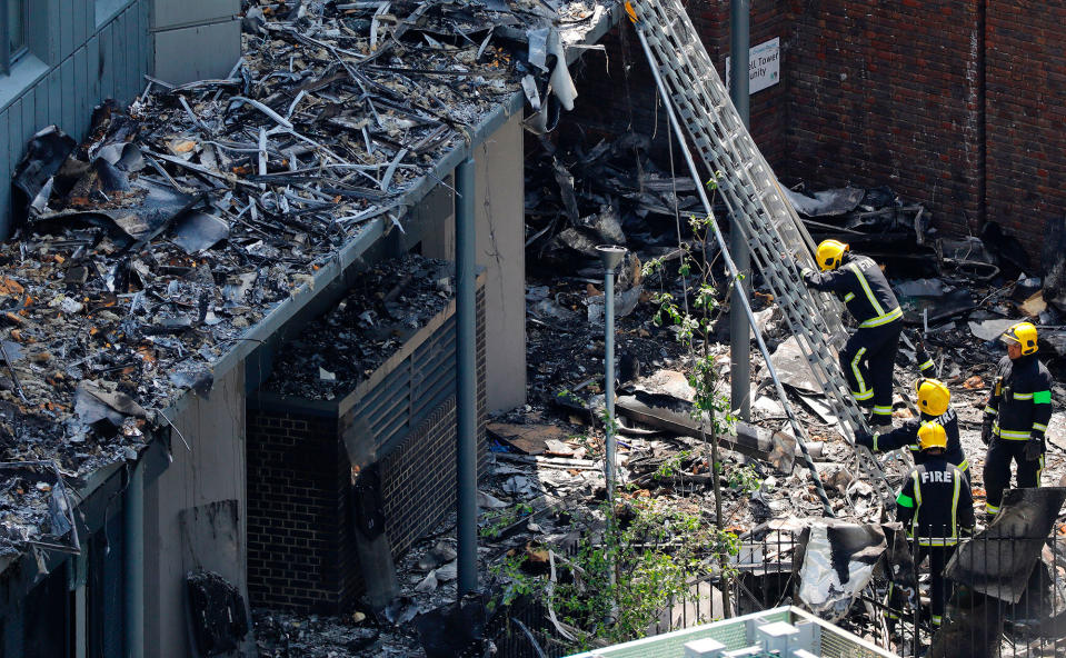 <p>Firefighteres work amongst debris at the base of the charred remnains of the Grenfell Tower block in Kensington, west London, on June 17, 2017, following the June 14 fire at the residential building.<br> (Tolga Akmen/AFP/Getty Images) </p>