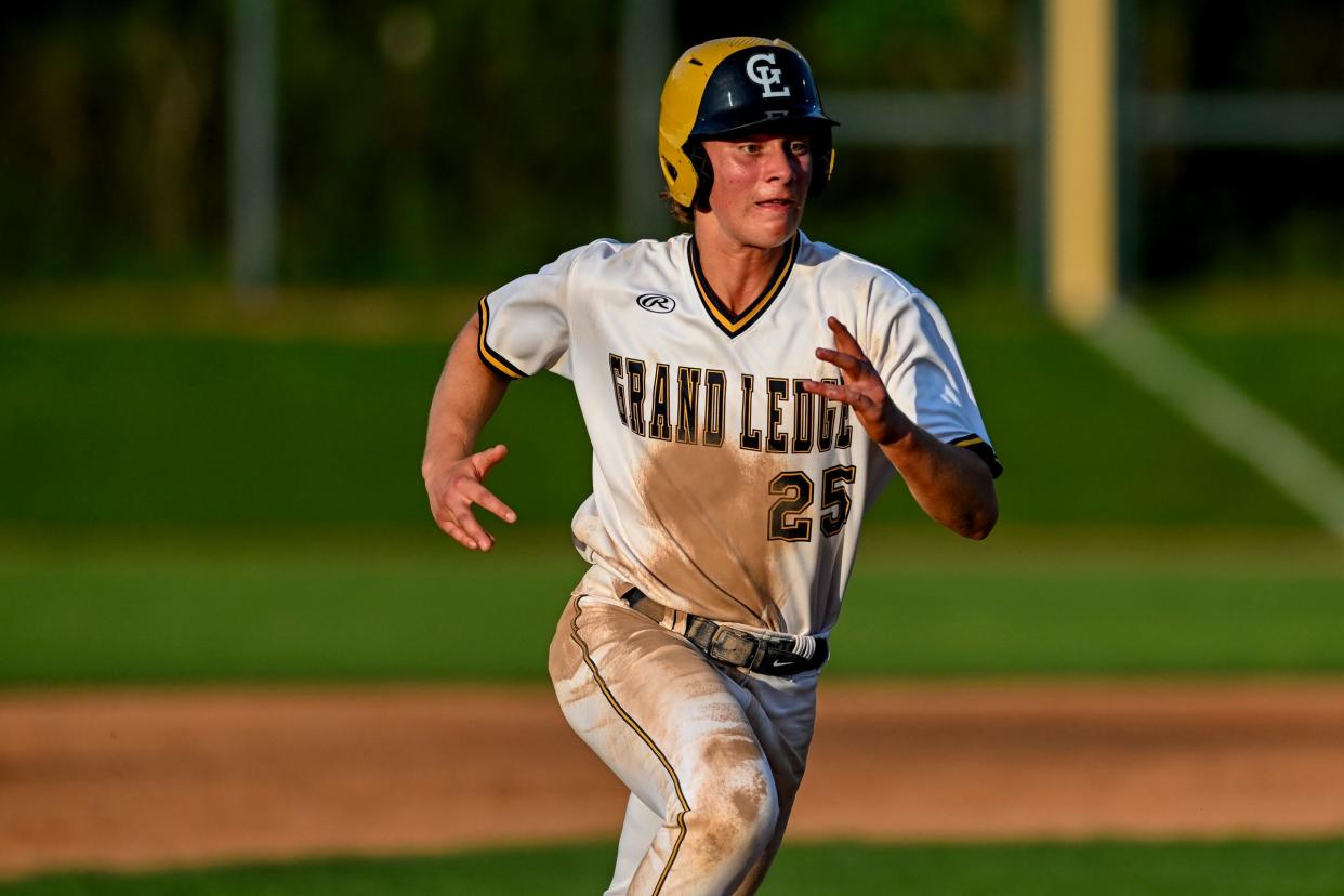 Grand Ledge's Jaydin McCammon advances to third base against St. Johns in the ninth inning on Tuesday, May 21, 2024, during the Diamond Classic at MSU's McLane Stadium in East Lansing