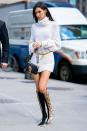 <p>Hadid wore a pair of Céline python print boots, a Dolce & Gabbana Lucia lizard-effect black leather shoulder bag, Chanel classic Jumbo logo chain, a pair of Luv Aj Baby Amalfi tube hoops in gold with a Denim BF cashmere turtleneck dress-sweater, November 2018.</p>