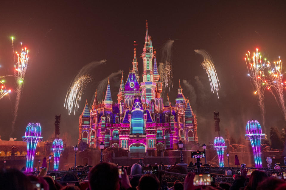 SHANGHAI, CHINA - JANUARY 30: Fireworks explode in front of the Enchanted Storybook Castle at Shanghai Disney Resort on January 30, 2023 in Shanghai, China. Shanghai Disney Resort holds a series of activities to celebrate the Spring Festival, or the Chinese Lunar New Year. (Photo by VCG/VCG via Getty Images)