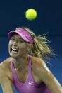 Maria Sharapova of Russia eyes the ball during her women's singles semi-finals match against Serena Williams of the U.S. at the Brisbane International tennis tournament January 3, 2014. REUTERS/Jason Reed