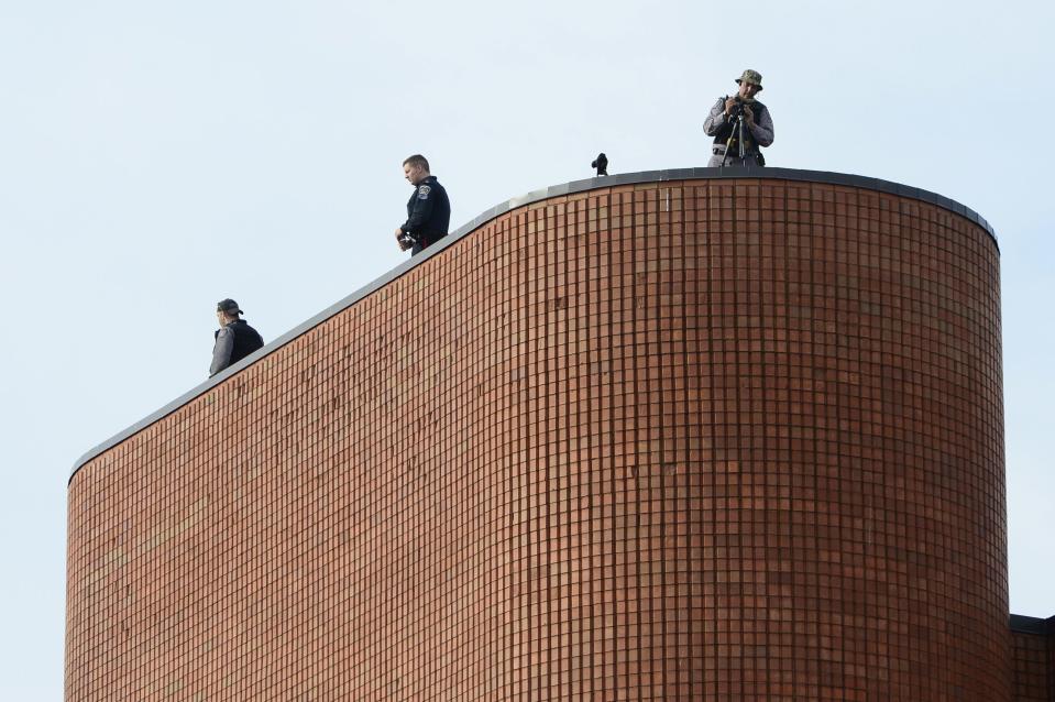 Police security sets up for the funeral for Cpl. Nathan Cirillo in Hamilton, Ontario, on Tuesday, Oct. 28, 2014. Cirillo was standing guard at the National War Memorial in Ottawa last Wednesday when he was killed by a gunman who went on to open fire on Parliament Hill before being shot down in a hail of bullets. Cirillo will be laid to rest in his southern Ontario hometown. (AP Photo/The Canadian Press, Frank Gunn)